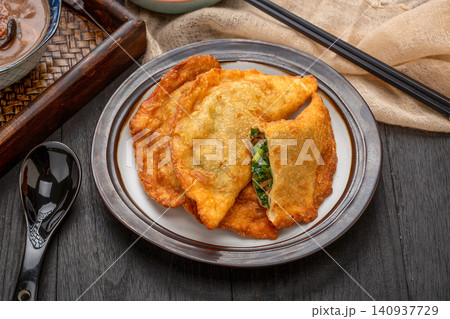 traditional Chinese Deep Fried Vegetable Dumplings, Crispy Golden Cai Jiao Pastry with Herb Filling traditional Chinese Deep Fried Vegetable Dumplings, Crispy Golden Cai Jiao Pastry with Herb Filling 140937729