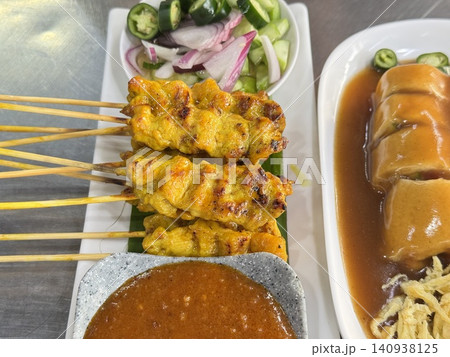 Traditional Thai Pork Satay Skewers With Peanut Dipping Sauce Traditional Thai Pork Satay Skewers With Peanut Dipping Sauce 140938125