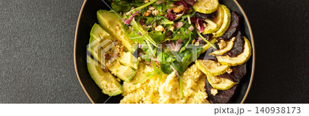 Millet porridge sits beside baked zucchini and beets. A salad made with spinach, arugula, and pink radish adds crunch with nuts and seeds. A wholesome meal for any time, banner Millet porridge sits beside baked zucchini and beets. A salad made with spinach, arugula, and pink radish adds crunch with nuts and seeds. A wholesome meal for any time, banner 140938173