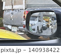 Car Side Mirror View Reflecting Heavy Traffic Jam On City Road 140938422