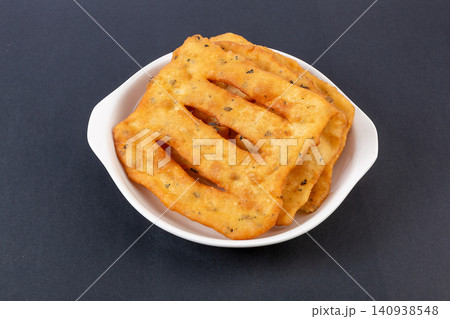 mini Fried Dough Sticks Seasoned with Sichuan Peppercorn Leaves, Aromatic Chinese Youtiao mini Fried Dough Sticks Seasoned with Sichuan Peppercorn Leaves, Aromatic Chinese Youtiao 140938548