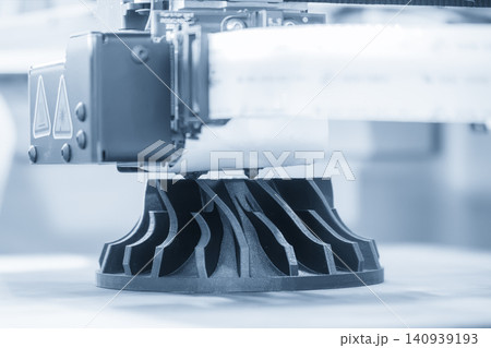 High-precision 3D printing machine operating to create intricate complex parts in a futuristic blue tone scene. 140939193