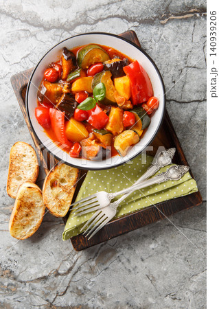 Ciambotta or giambotta is a summer vegetable stew of southern Italian cuisine closeup on the plate. Vertical top view 140939206