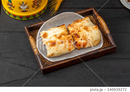 traditional Xinjiang Roasted Mutton Buns, Crispy Clay Oven Baked Samsa with Meat Filling 140939272