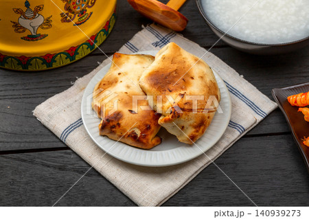 traditional Xinjiang Roasted Mutton Buns, Crispy Clay Oven Baked Samsa with Meat Filling traditional Xinjiang Roasted Mutton Buns, Crispy Clay Oven Baked Samsa with Meat Filling 140939273