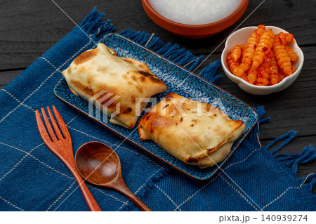 traditional Xinjiang Roasted Mutton Buns, Crispy Clay Oven Baked Samsa with Meat Filling 140939274