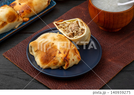 traditional Xinjiang Roasted Mutton Buns, Crispy Clay Oven Baked Samsa with Meat Filling traditional Xinjiang Roasted Mutton Buns, Crispy Clay Oven Baked Samsa with Meat Filling 140939275