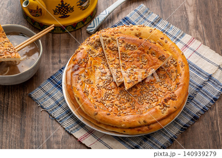 xinjiang Naan Flatbread Topped with Crunchy Sunflower Seeds, Traditional Roasted Nutty Bread xinjiang Naan Flatbread Topped with Crunchy Sunflower Seeds, Traditional Roasted Nutty Bread 140939279