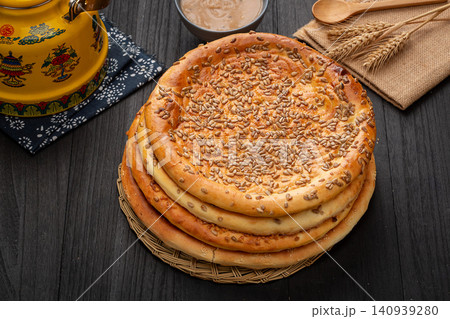 xinjiang Naan Flatbread Topped with Crunchy Sunflower Seeds, Traditional Roasted Nutty Bread xinjiang Naan Flatbread Topped with Crunchy Sunflower Seeds, Traditional Roasted Nutty Bread 140939280