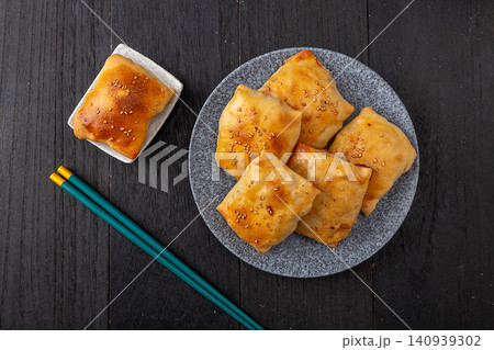 authentic Xinjiang Roasted Mutton Buns, Clay Oven Baked Samsa Pastry with Meat Filling 140939302