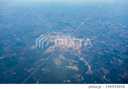 Aerial view over secluded town surrounded by agricultural plantations in the interior of Brazil Aerial view over secluded town surrounded by agricultural plantations in the interior of Brazil 140939848
