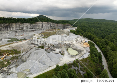 Sand open-pit mining quarry with processing plant for crushed stone. Extracting of natural resources for construction industry Sand open-pit mining quarry with processing plant for crushed stone. Extracting of natural resources for construction industry 140940354