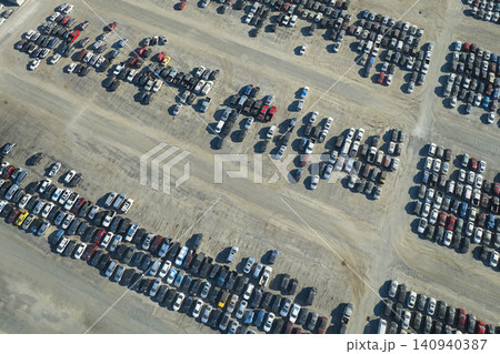 Aerial view of auction reseller company big parking lot with parked cars ready for remarketing services. Sales of secondhand vehicles 140940387