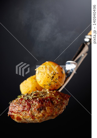 Roasted potatoes with cutlet and thyme. Roasted potatoes with cutlet and thyme. 140940496