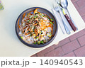 Close-up of a healthy salmon poke bowl with rice and sliced avocado 140940543