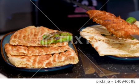 Video Traditional Turkish pide ramadan pita bread served with turkish minced smoked meat - Ramazan pidesi. Video turkish bread 140940599