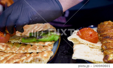 Video Traditional Turkish pide ramadan pita bread served with turkish minced smoked meat and vegetables - Ramazan pidesi. Video turkish bread Video Traditional Turkish pide ramadan pita bread served with turkish minced smoked meat and vegetables - Ramazan pidesi. Video turkish bread 140940601