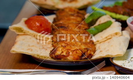 Video Luxury Lavish Turkish Dining Table Overflowing with Traditional Food, Meat Dishes, Fresh Bread and Meze 140940604
