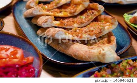 Full Turkish Family Feast Table with Traditional Food, Grilled Meat, Meze and Rustic Bread Full Turkish Family Feast Table with Traditional Food, Grilled Meat, Meze and Rustic Bread 140940621
