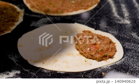 Man Preparing and baking pita kiymal pide and lahmacun. Turkish pizza video Man Preparing and baking pita kiymal pide and lahmacun. Turkish pizza video 140940628