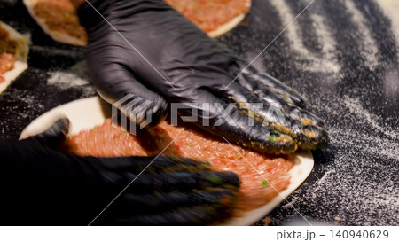Man Preparing and baking pita kiymal pide and lahmacun. Turkish pizza video Man Preparing and baking pita kiymal pide and lahmacun. Turkish pizza video 140940629