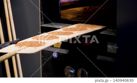 Man Preparing and baking pita kiymal pide and lahmacun. Turkish pizza in the oven video Man Preparing and baking pita kiymal pide and lahmacun. Turkish pizza in the oven video 140940630