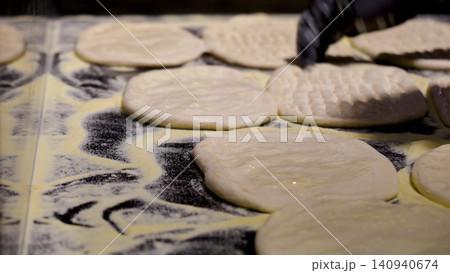 Video of a making a dough for turkish bread. The flying flour. Traditional turkish baking concept. Turkish bread. Homemade bread. Video of a making a dough for turkish bread. The flying flour. Traditional turkish baking concept. Turkish bread. Homemade bread. 140940674