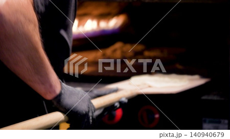 Video of a putting a dough for turkish bread in the oven. The flying flour. Traditional turkish baking concept. Turkish bread. Homemade bread. Video of a putting a dough for turkish bread in the oven. The flying flour. Traditional turkish baking concept. Turkish bread. Homemade bread. 140940679
