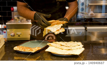 Man making Traditional Turkish pide ramadan pita bread - Ramazan pidesi. Video turkish bread Man making Traditional Turkish pide ramadan pita bread - Ramazan pidesi. Video turkish bread 140940687