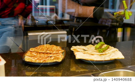 Man making Traditional Turkish pide ramadan pita bread - Ramazan pidesi. Video turkish bread Man making Traditional Turkish pide ramadan pita bread - Ramazan pidesi. Video turkish bread 140940688