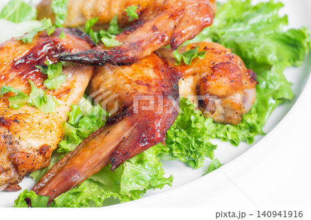 Fried chicken wings with herbs. Close-up. Fried chicken wings with herbs. Close-up. 140941916