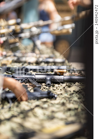 Military assault rifles in weapon defense exhibition Military assault rifles in weapon defense exhibition 140942472