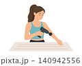 Woman Using Massage Gun on Forearm at Home, Muscle Recovery and Pain Relief 140942556