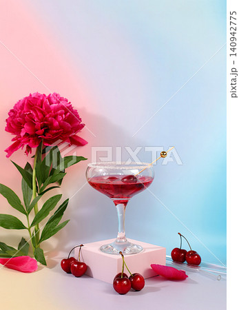 Iced cherry punch with ice for a party, modern still life with summer alcoholic cocktail and burgundy peonies on a modern sunny background, minimalist concept for a bar and cafe, advertising banner 140942775