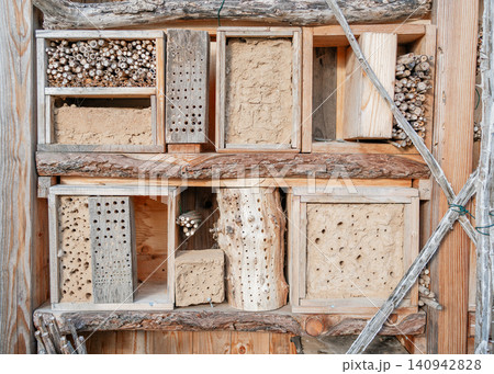 Insect houses made of different materials: clay, wood. High quality photo Insect houses made of different materials: clay, wood. High quality photo 140942828