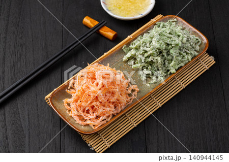 Chinese duo color steamed vegetables with flour coated shredded carrots and crown daisy Chinese duo color steamed vegetables with flour coated shredded carrots and crown daisy 140944145