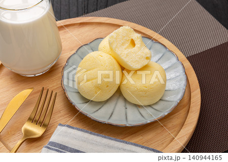 Fluffy steamed cakes cut open on plate, low fat fitness meal replacement snack Fluffy steamed cakes cut open on plate, low fat fitness meal replacement snack 140944165