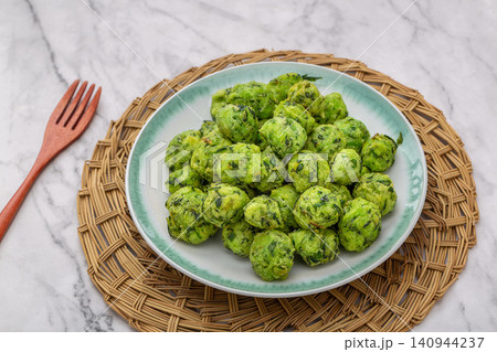 crispy Fried Chive Balls, Traditional Green Vegetable and Herb Dumpling Balls crispy Fried Chive Balls, Traditional Green Vegetable and Herb Dumpling Balls 140944237