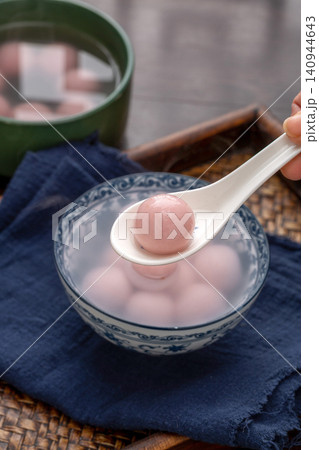 pink strawberry flavored sweet rice balls, cooked colorful Chinese Tangyuan mochi dessert 140944643