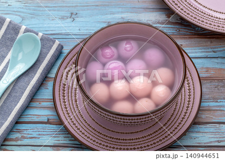 purple blueberry flavored sweet glutinous rice balls, creative Chinese Tangyuan mochi dessert 140944651