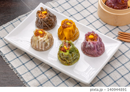 assorted multi flavor Chinese shumai dumplings, colorful steamed Siu Mai with mixed fillings, traditional asian dim sum assorted multi flavor Chinese shumai dumplings, colorful steamed Siu Mai with mixed fillings, traditional asian dim sum 140944891