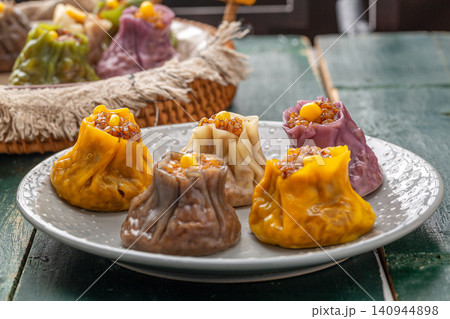 assorted multi flavor Chinese shumai dumplings, colorful steamed Siu Mai with mixed fillings, traditional asian dim sum assorted multi flavor Chinese shumai dumplings, colorful steamed Siu Mai with mixed fillings, traditional asian dim sum 140944898