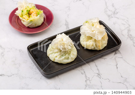 traditional Chinese paper skin shumai dumplings, steamed thin wrapper Siu Mai with savory glutinous rice filling traditional Chinese paper skin shumai dumplings, steamed thin wrapper Siu Mai with savory glutinous rice filling 140944903