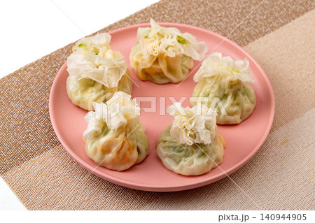 traditional Chinese paper skin shumai dumplings, steamed thin wrapper Siu Mai with savory glutinous rice filling traditional Chinese paper skin shumai dumplings, steamed thin wrapper Siu Mai with savory glutinous rice filling 140944905