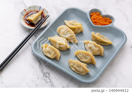 chinese traditional steamed dumplings, cooked Shaxian snacks Jiaozi with savory pork filling, authentic asian dim sum chinese traditional steamed dumplings, cooked Shaxian snacks Jiaozi with savory pork filling, authentic asian dim sum 140944912