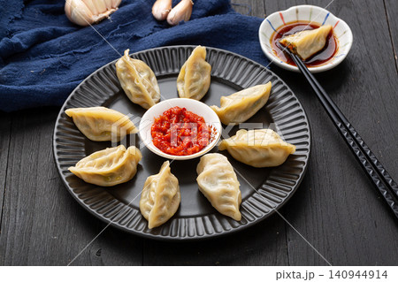 chinese traditional steamed dumplings, cooked Shaxian snacks Jiaozi with savory pork filling, authentic asian dim sum chinese traditional steamed dumplings, cooked Shaxian snacks Jiaozi with savory pork filling, authentic asian dim sum 140944914