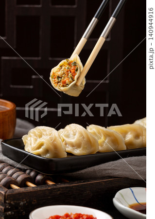 chinese traditional steamed dumplings, cooked Shaxian snacks Jiaozi with savory pork filling, authentic asian dim sum chinese traditional steamed dumplings, cooked Shaxian snacks Jiaozi with savory pork filling, authentic asian dim sum 140944916