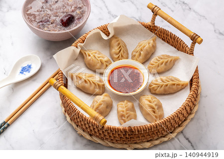 chinese traditional steamed dumplings, cooked Shaxian snacks Jiaozi with savory pork filling, authentic asian dim sum chinese traditional steamed dumplings, cooked Shaxian snacks Jiaozi with savory pork filling, authentic asian dim sum 140944919