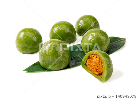 salted egg yolk and meat floss green rice ball, cut Qingtuan mochi showing savory filling on white background salted egg yolk and meat floss green rice ball, cut Qingtuan mochi showing savory filling on white background 140945079