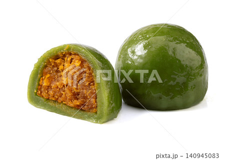 salted egg yolk and meat floss green rice ball, cut Qingtuan mochi showing savory filling on white background 140945083